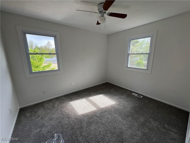 1279 Lander Rd, Mayfield Heights, OH 44124 - spare room featuring carpet, visible vents, baseboards, and ceiling fan