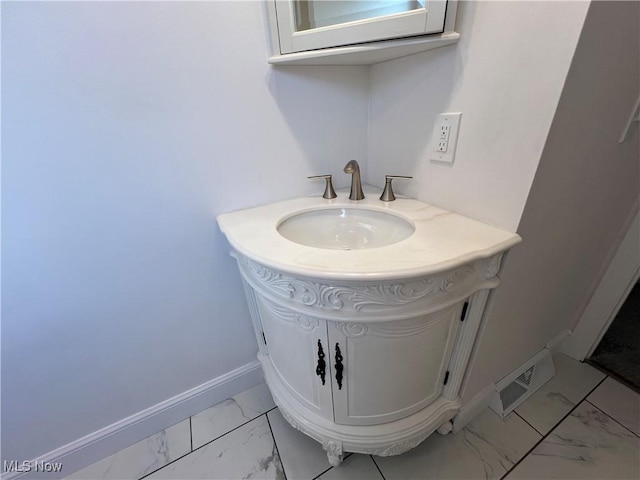 1279 Lander Rd, Mayfield Heights, OH 44124 - bathroom with baseboards, marble finish floor, vanity, and visible vents