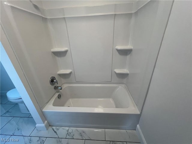 1279 Lander Rd, Mayfield Heights, OH 44124 - bathroom with toilet, marble finish floor, baseboards, and tub / shower combination