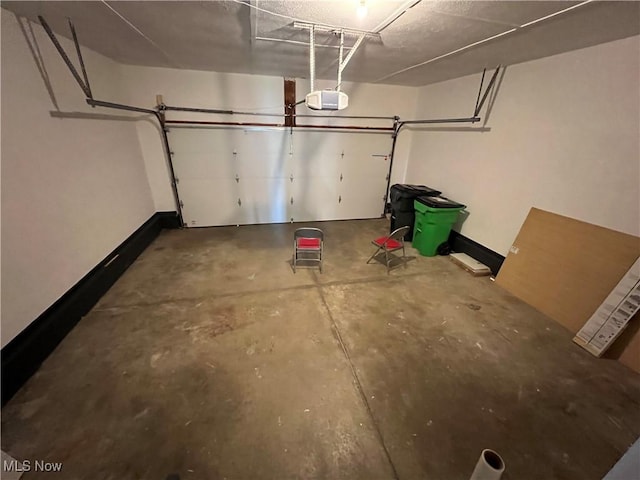 1279 Lander Rd, Mayfield Heights, OH 44124 - garage with baseboards and a garage door opener