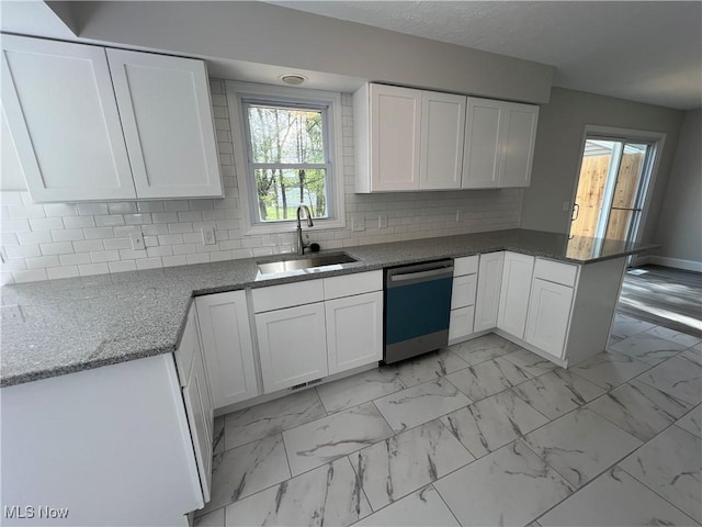 1279 Lander Rd, Mayfield Heights, OH 44124 - kitchen featuring a sink, a peninsula, stone countertops, dishwasher, and white cabinets