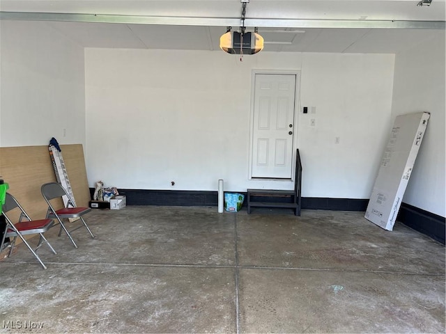 1279 Lander Rd, Mayfield Heights, OH 44124 - garage featuring a garage door opener