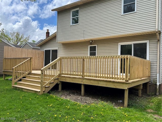 1279 Lander Rd, Mayfield Heights, OH 44124 - back of property featuring a yard, a wooden deck, stairs, and fence