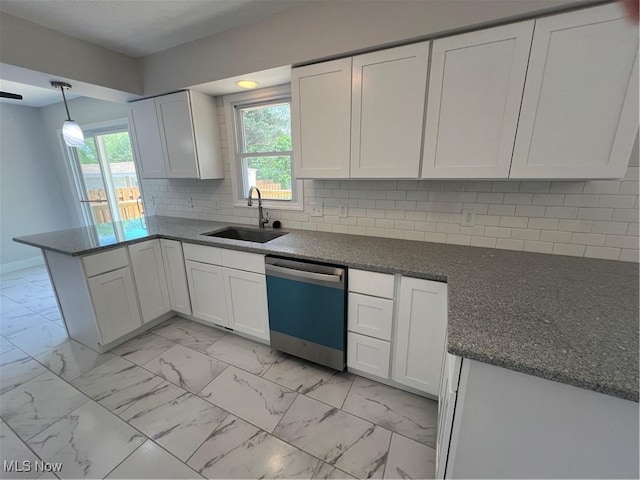 1279 Lander Rd, Mayfield Heights, OH 44124 - kitchen featuring a sink, a peninsula, marble finish floor, dishwasher, and white cabinets