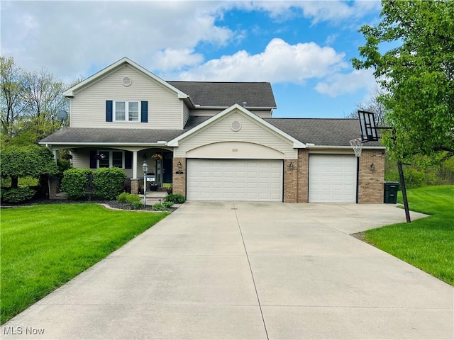 view of front of home with driveway, brick siding, covered porch, a garage, and a front yard