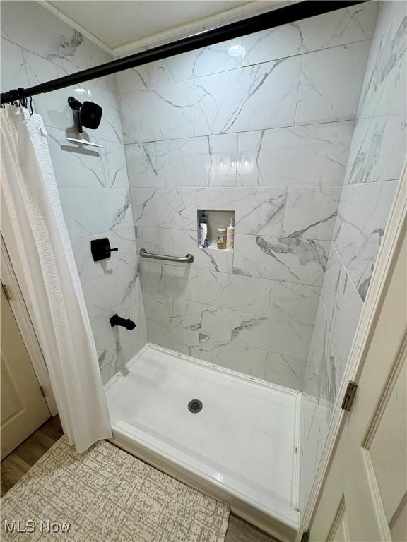 bathroom featuring a shower stall