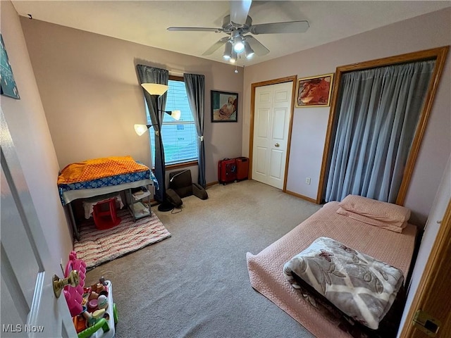 bedroom featuring carpet, baseboards, and a ceiling fan