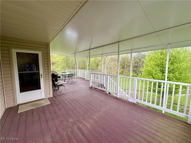 wooden deck featuring outdoor dining space