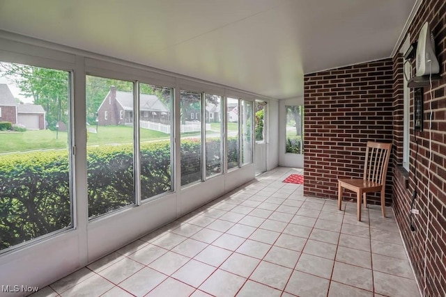 unfurnished sunroom featuring plenty of natural light