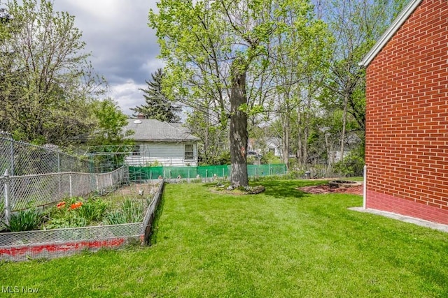 view of yard featuring a garden and fence