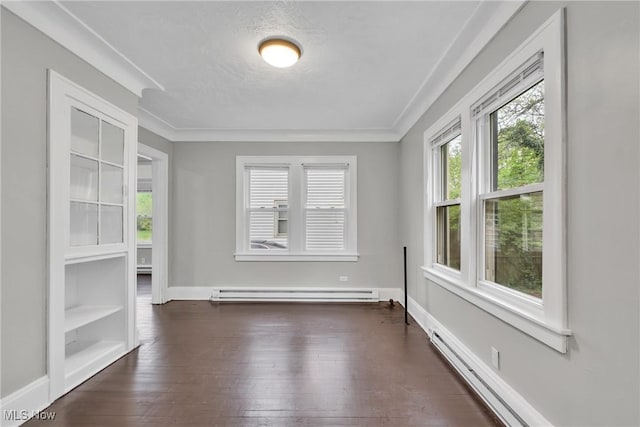 interior space with dark wood-style flooring, baseboards, baseboard heating, and a baseboard heating unit
