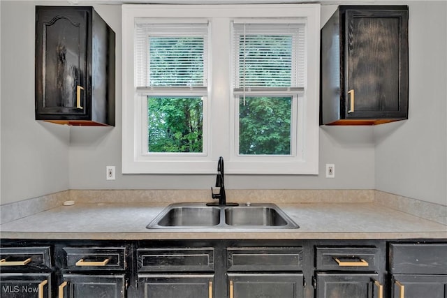 kitchen with light countertops and a sink