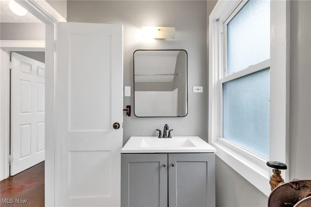 bathroom with vanity and a wealth of natural light
