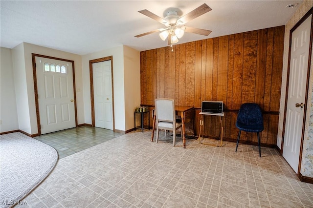 4991 Walnut St, Sugarcreek, OH 44681 - office space with baseboards, wooden walls, and a ceiling fan