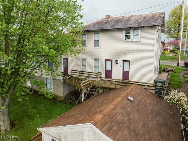 4991 Walnut St, Sugarcreek, OH 44681 - rear view of house with a chimney and a wooden deck