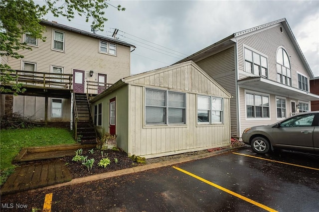 4991 Walnut St, Sugarcreek, OH 44681 - exterior space with uncovered parking and stairway