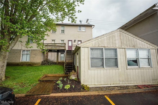 4991 Walnut St, Sugarcreek, OH 44681 - back of property with a lawn and stairs