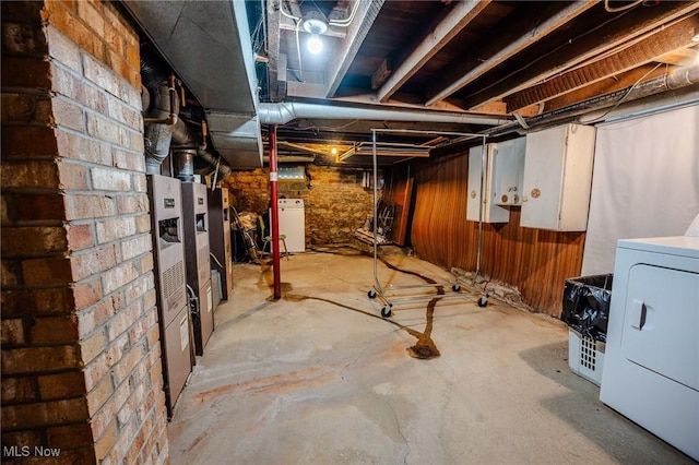 4991 Walnut St, Sugarcreek, OH 44681 - unfinished below grade area featuring washer / dryer and wooden walls