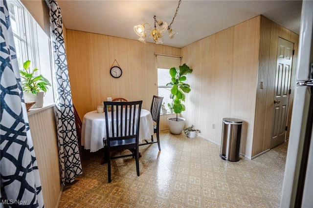 4991 Walnut St, Sugarcreek, OH 44681 - dining area featuring baseboards and an inviting chandelier