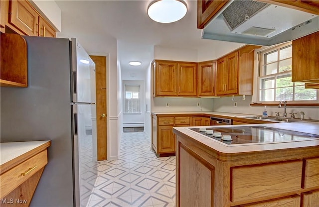 4840 W 228th St, Fairview Park, OH 44126 - kitchen with under cabinet range hood, appliances with stainless steel finishes, light countertops, and a sink