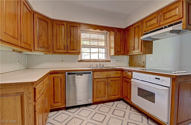 4840 W 228th St, Fairview Park, OH 44126 - kitchen featuring stainless steel dishwasher, under cabinet range hood, a sink, white oven, and electric stovetop