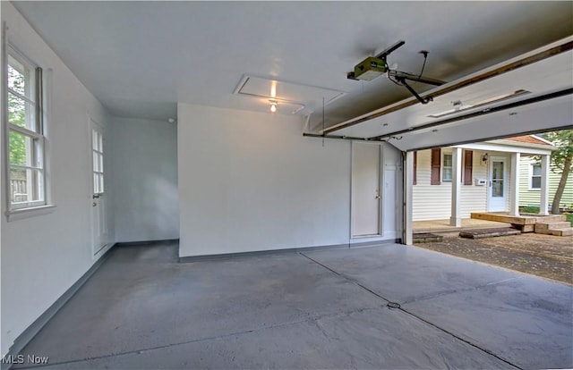 4840 W 228th St, Fairview Park, OH 44126 - garage featuring a garage door opener and baseboards