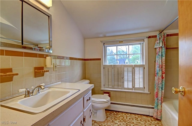 4840 W 228th St, Fairview Park, OH 44126 - bathroom featuring baseboard heating, tile walls, toilet, lofted ceiling, and vanity