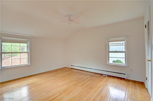 4840 W 228th St, Fairview Park, OH 44126 - empty room with a baseboard radiator, a ceiling fan, lofted ceiling, and hardwood / wood-style floors