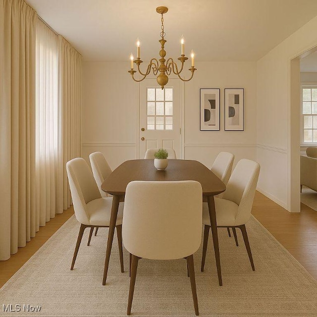 4840 W 228th St, Fairview Park, OH 44126 - dining room with a chandelier and light wood-style flooring