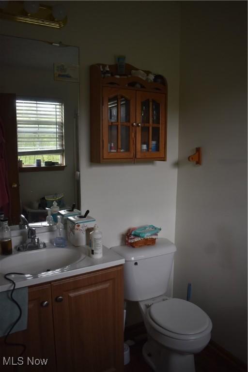 bathroom featuring vanity and toilet