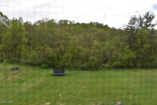exterior space with a view of trees