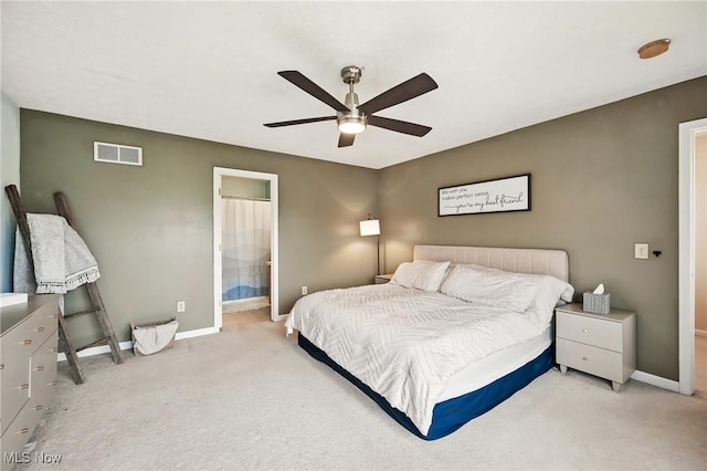 bedroom featuring light colored carpet, visible vents, baseboards, and ceiling fan