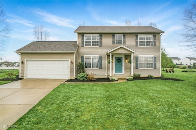 colonial home featuring concrete driveway, a front yard, a shingled roof, and an attached garage