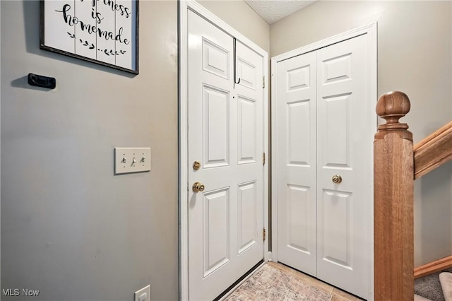 doorway to outside featuring stairway