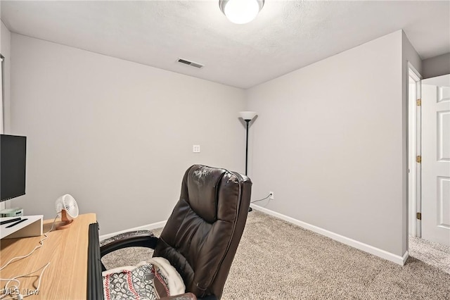 office area with baseboards, carpet flooring, and visible vents