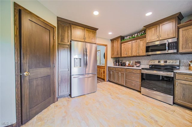 4661 Sugar Grove Rd, Cambridge, OH 43725 - kitchen featuring stainless steel appliances, tasteful backsplash, light countertops, and recessed lighting