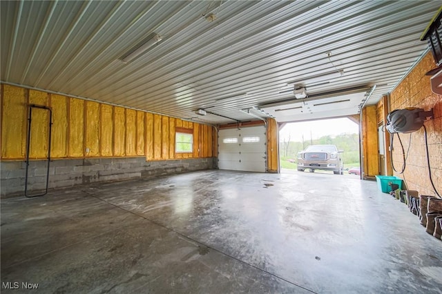4661 Sugar Grove Rd, Cambridge, OH 43725 - garage with a garage door opener and concrete block wall