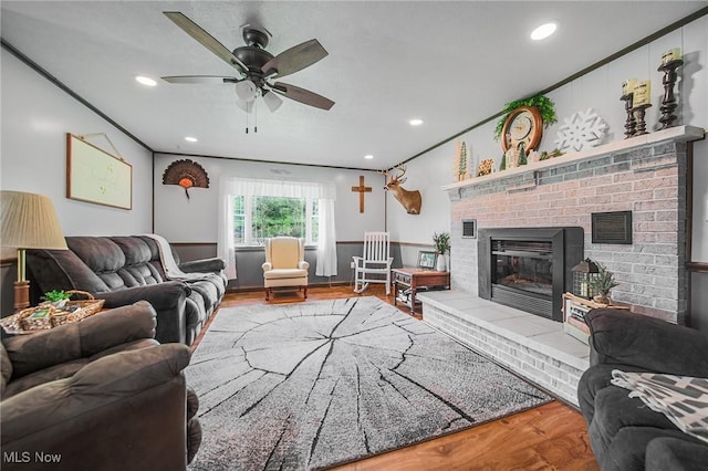 4661 Sugar Grove Rd, Cambridge, OH 43725 - living area with a ceiling fan, a fireplace, visible vents, and wood finished floors
