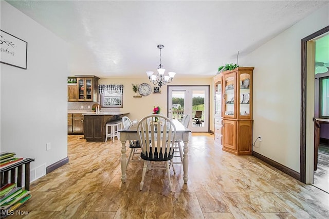 4661 Sugar Grove Rd, Cambridge, OH 43725 - dining space with baseboards, a notable chandelier, and french doors