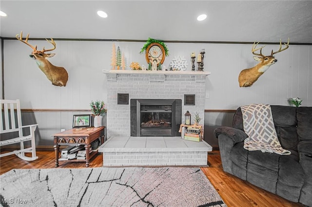 4661 Sugar Grove Rd, Cambridge, OH 43725 - living area with visible vents, wood finished floors, a brick fireplace, and recessed lighting