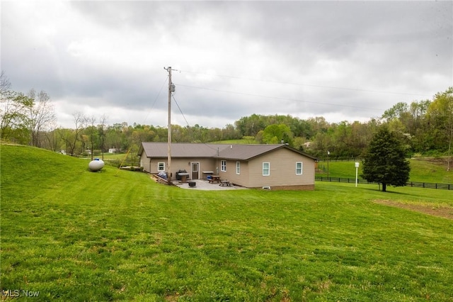 4661 Sugar Grove Rd, Cambridge, OH 43725 - rear view of property with a patio area, fence, and a lawn