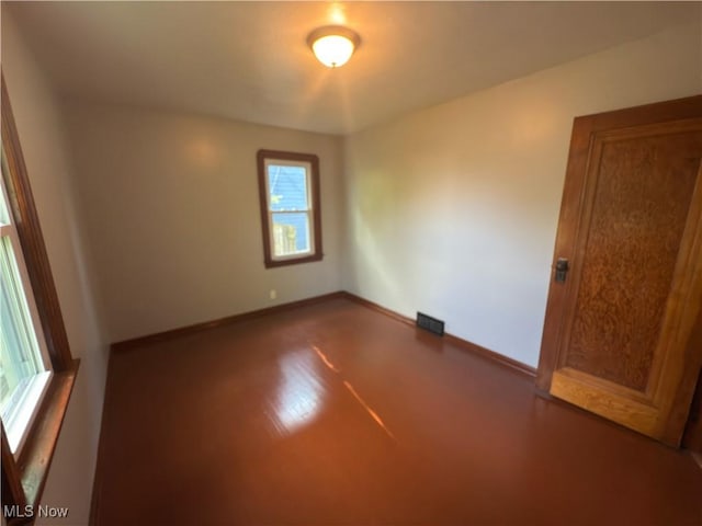 131 Blake St, Elyria, OH 44035 - spare room with baseboards, visible vents, and plenty of natural light