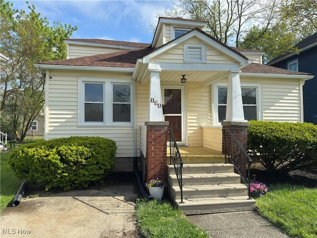 131 Blake St, Elyria, OH 44035 - bungalow-style home with roof with shingles