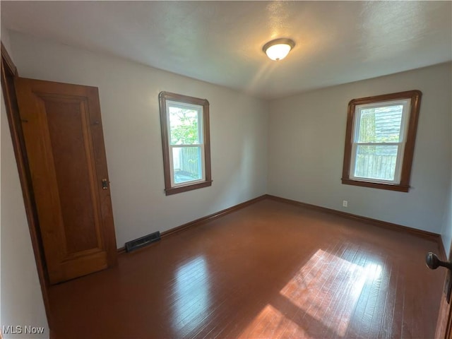 131 Blake St, Elyria, OH 44035 - spare room featuring baseboards and hardwood / wood-style floors