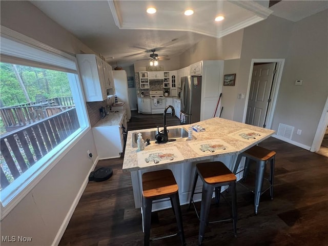 37080 Penrose Ln, Cadiz, OH 43907 - kitchen featuring freestanding refrigerator, baseboards, white cabinetry, light countertops, and a ceiling fan