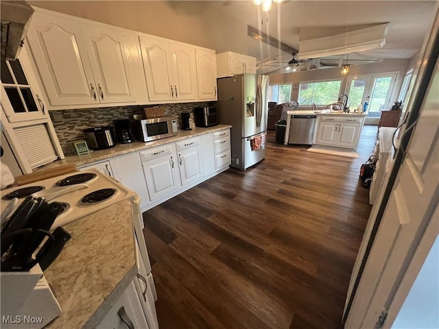 37080 Penrose Ln, Cadiz, OH 43907 - kitchen with appliances with stainless steel finishes, backsplash, white cabinets, and a ceiling fan