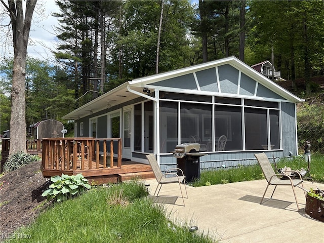 37080 Penrose Ln, Cadiz, OH 43907 - back of house with a sunroom, a deck, and a patio area
