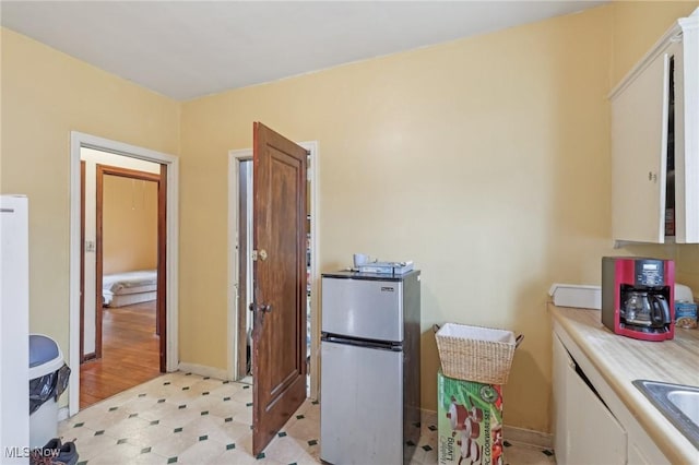 2419 Carpenter Rd, Ashtabula, OH 44004 - clothes washing area with baseboards