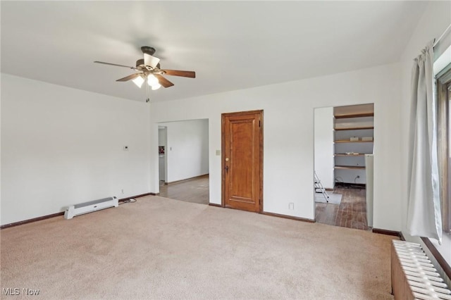 2419 Carpenter Rd, Ashtabula, OH 44004 - unfurnished bedroom with radiator, ceiling fan, carpet flooring, baseboard heating, and baseboards