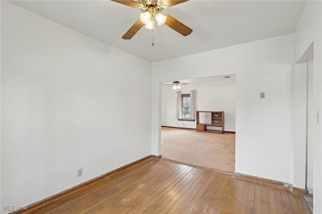 2419 Carpenter Rd, Ashtabula, OH 44004 - unfurnished room with a ceiling fan, baseboards, and hardwood / wood-style flooring